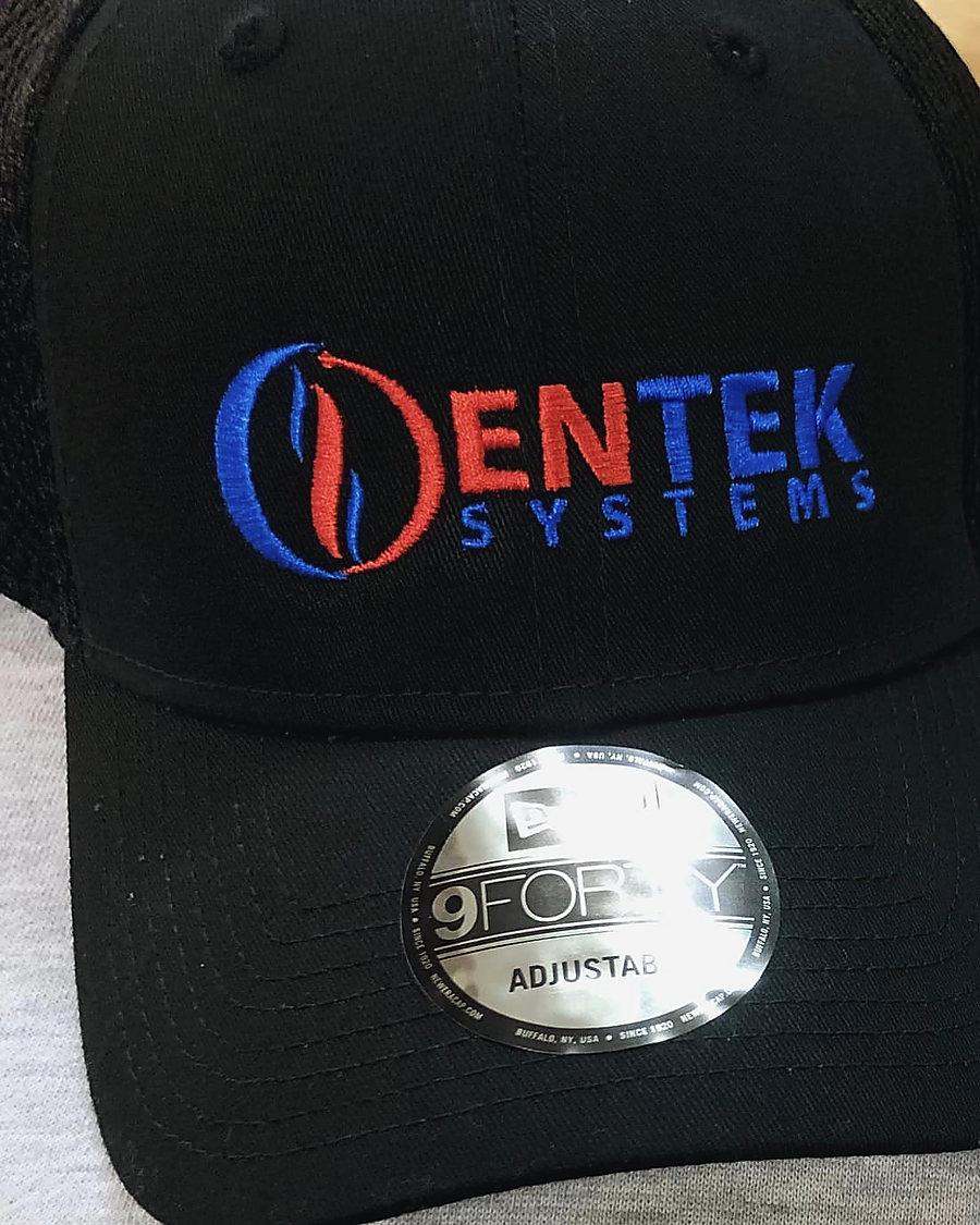 A black cap embroidered with the Entek Systems logo in blue and red