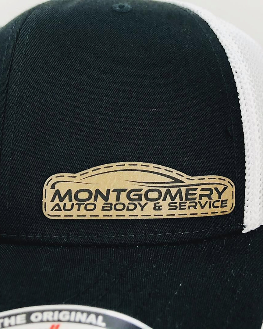 A Montgomery Auto Body leather patch cap