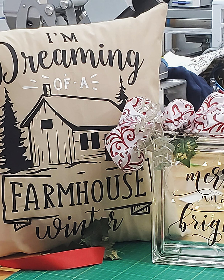 A burlap Farmhouse Winter pillow beside a Merry and Bright glass block