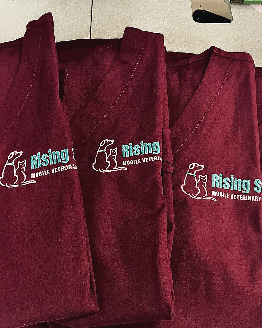 Scrub tops for a mobile veterinary practice
